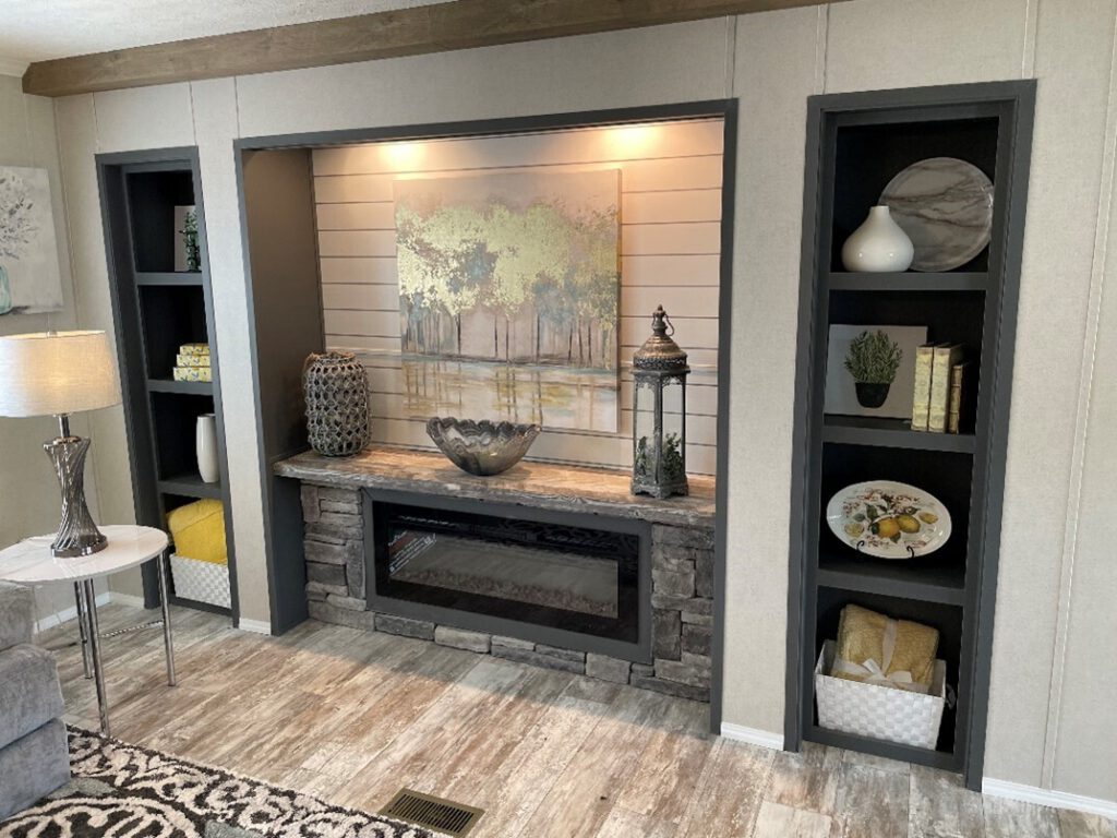 Sheetrock entertainment center over rock electric fireplace