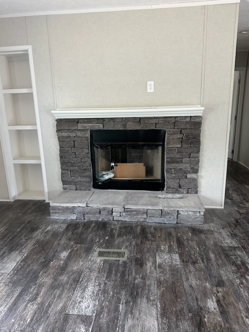 Half-rock fireplace with bookcase